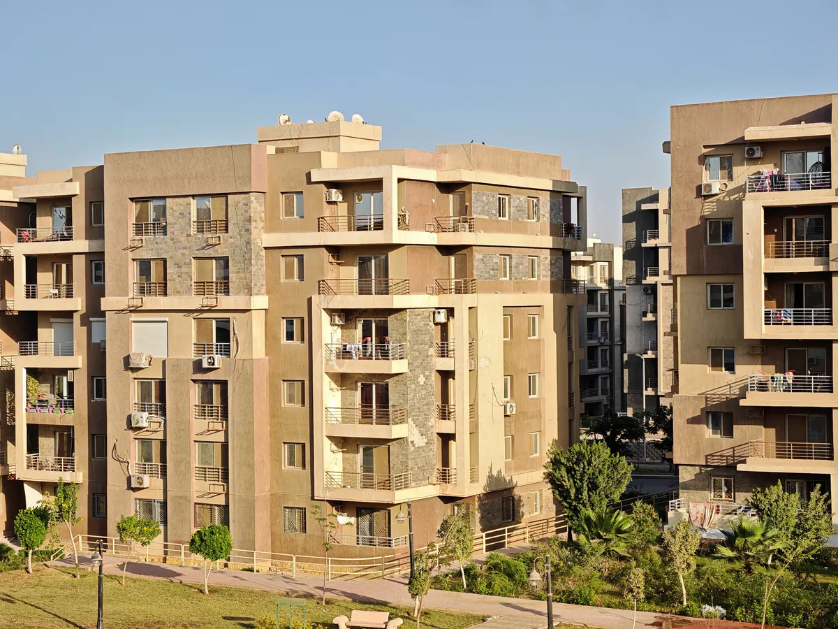 Modern residential apartment buildings in the Naseej District of Aljada, Sharjah, showing completed architecture.
